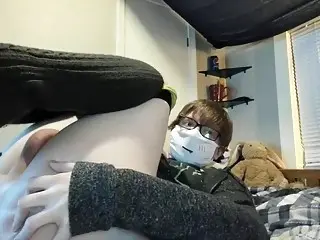 Shy femboy wears a mask during his webcam show