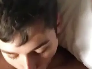Cute young boy blowing older